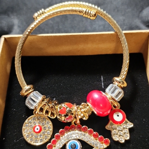 GOLD STAINLESS STEEL TWIST CHARM BRACELET - Picture 3 of 5